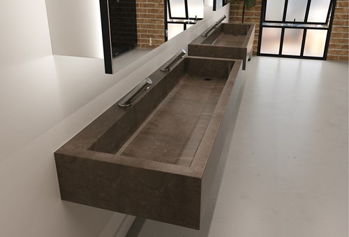 Solid surface washtrough in a modern commercial washroom